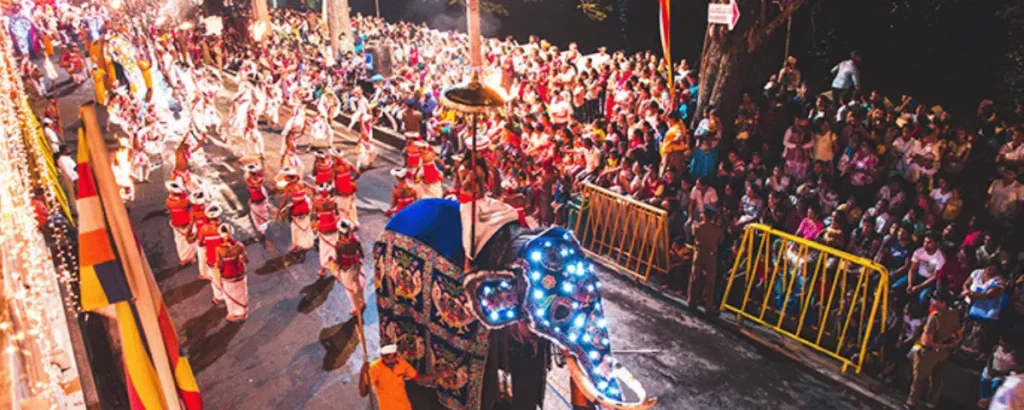 Kandy Esala Perahera procession with decorated elephants and traditional dancers in Kandy, Sri Lanka