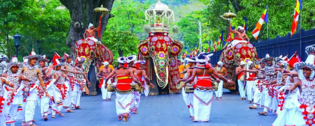 Kandy Esala Perahera procession with traditional dancers, drummers and decorated elephants in Kandy, Sri Lanka