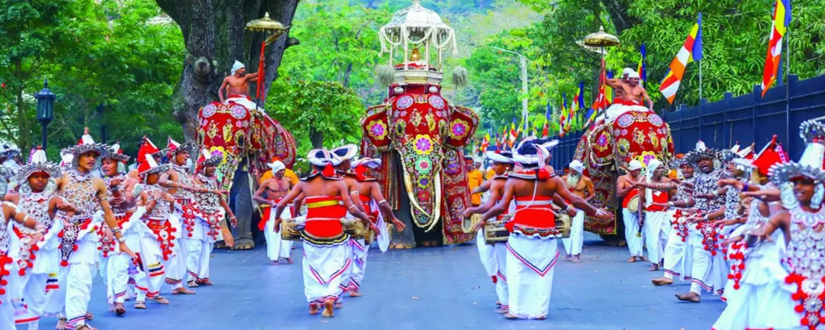 Kandy Esala Perahera procession with traditional dancers, drummers and decorated elephants in Kandy, Sri Lanka