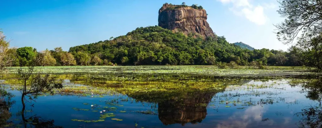 Sigiriya Rock Fortress rising above the surrounding Sri Lankan landscape